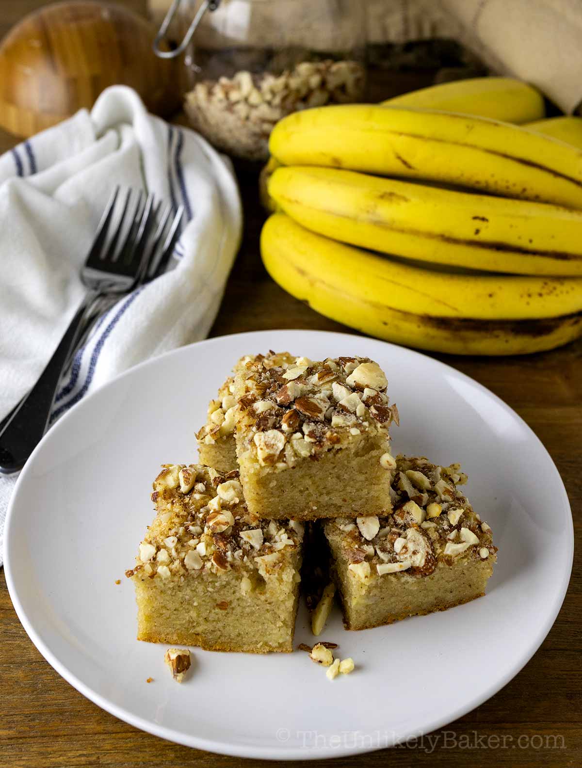 Banana bread mochi squares on a plate.
