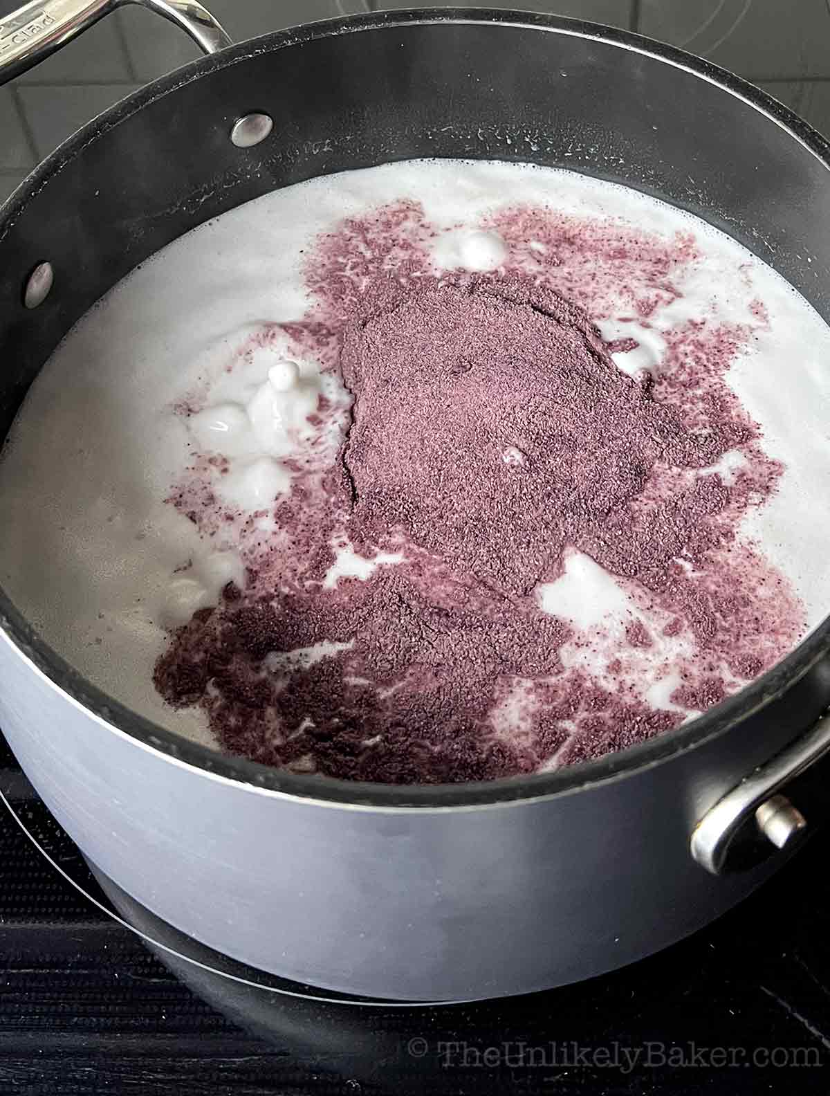Ube powder added to coconut milk.