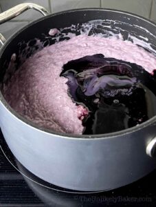 Ube condensed milk added to mixture.