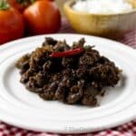 Sweet and spicy Filipino beef tapa on a plate.