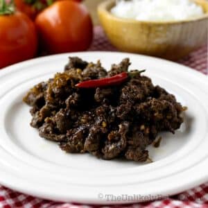 Sweet and spicy Filipino beef tapa on a plate.