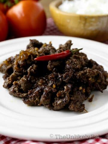 Sweet and spicy Filipino beef tapa on a plate.