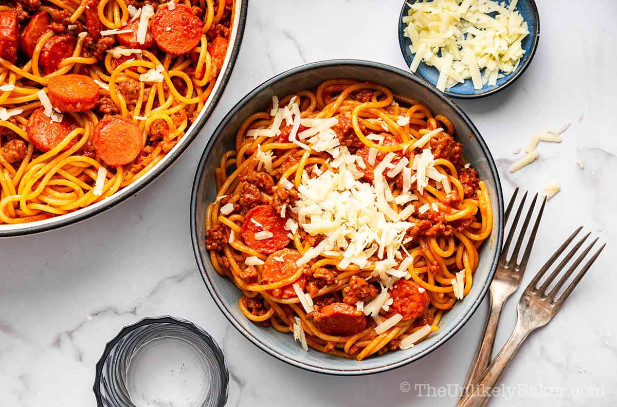 Filipino spaghetti sauce with cooked spaghetti noodles.