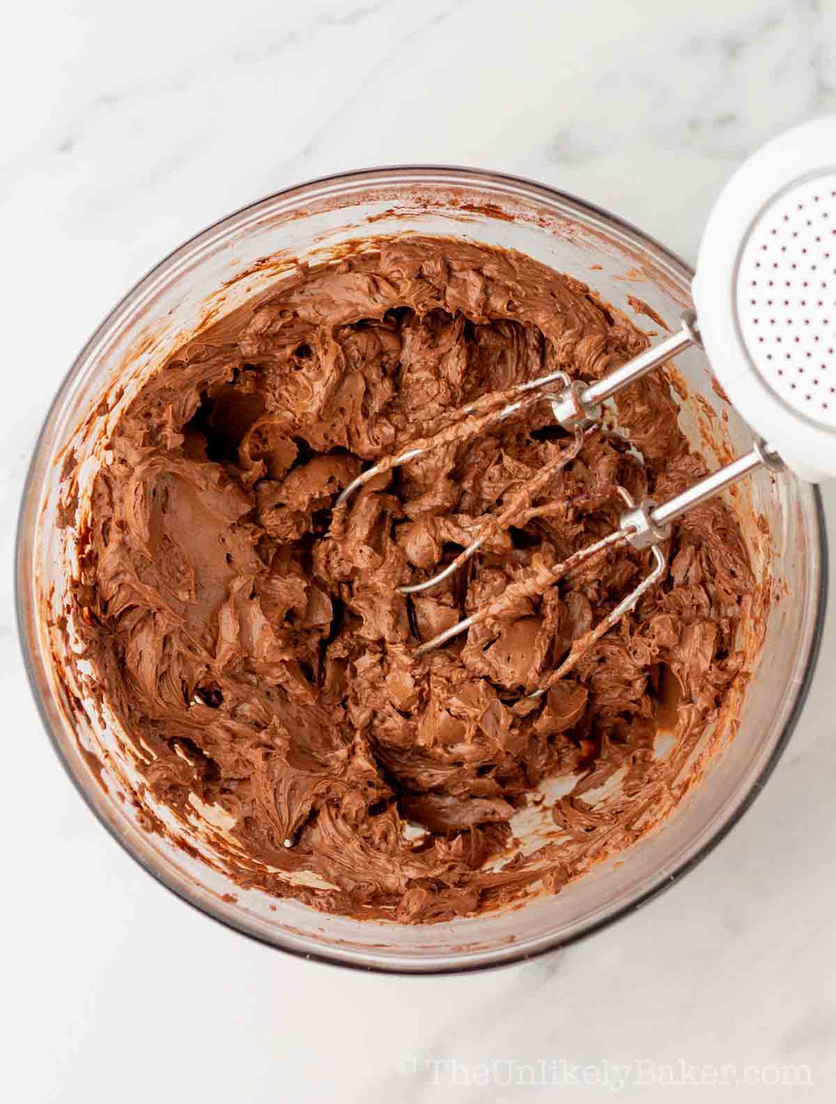 Frosting mixture in a bowl.