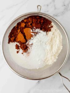 Dry ingredients sifted into a bowl.