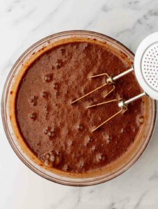 Chocolate cake batter in a bowl.