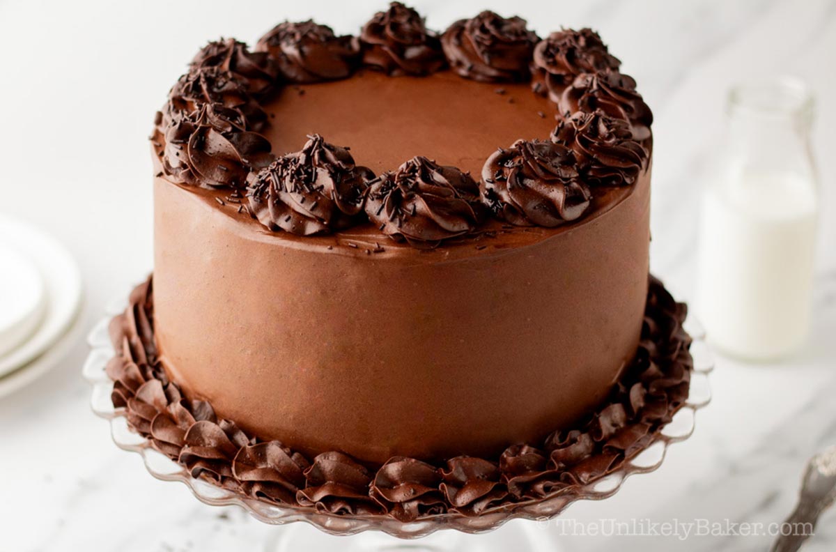 Chocolate overload cake on a cake stand.