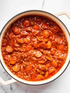 Filipino spaghetti sauce simmering in a pan.