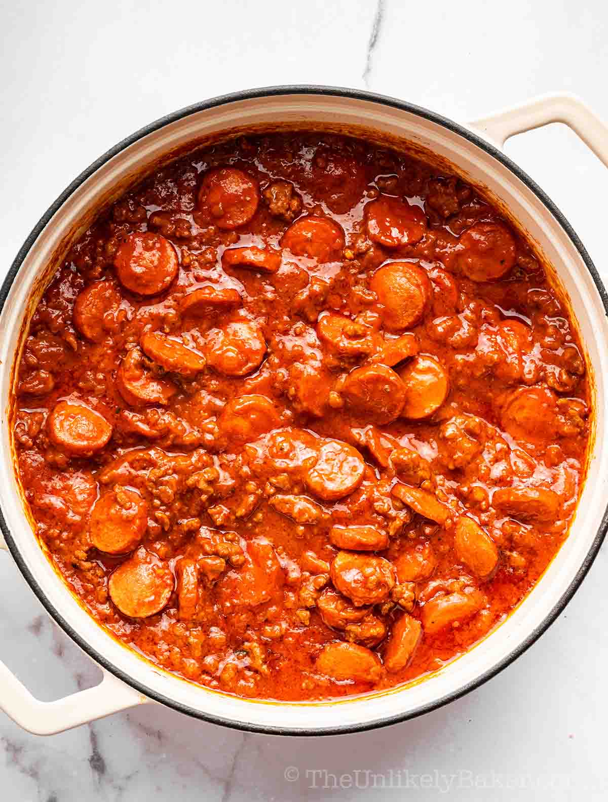 Filipino spaghetti sauce simmering in a pan.