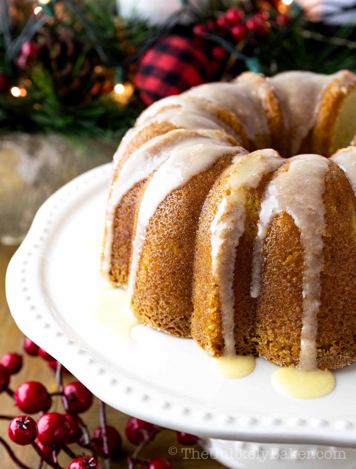 Eggnog pound cake with eggnog glaze on a cake platter.