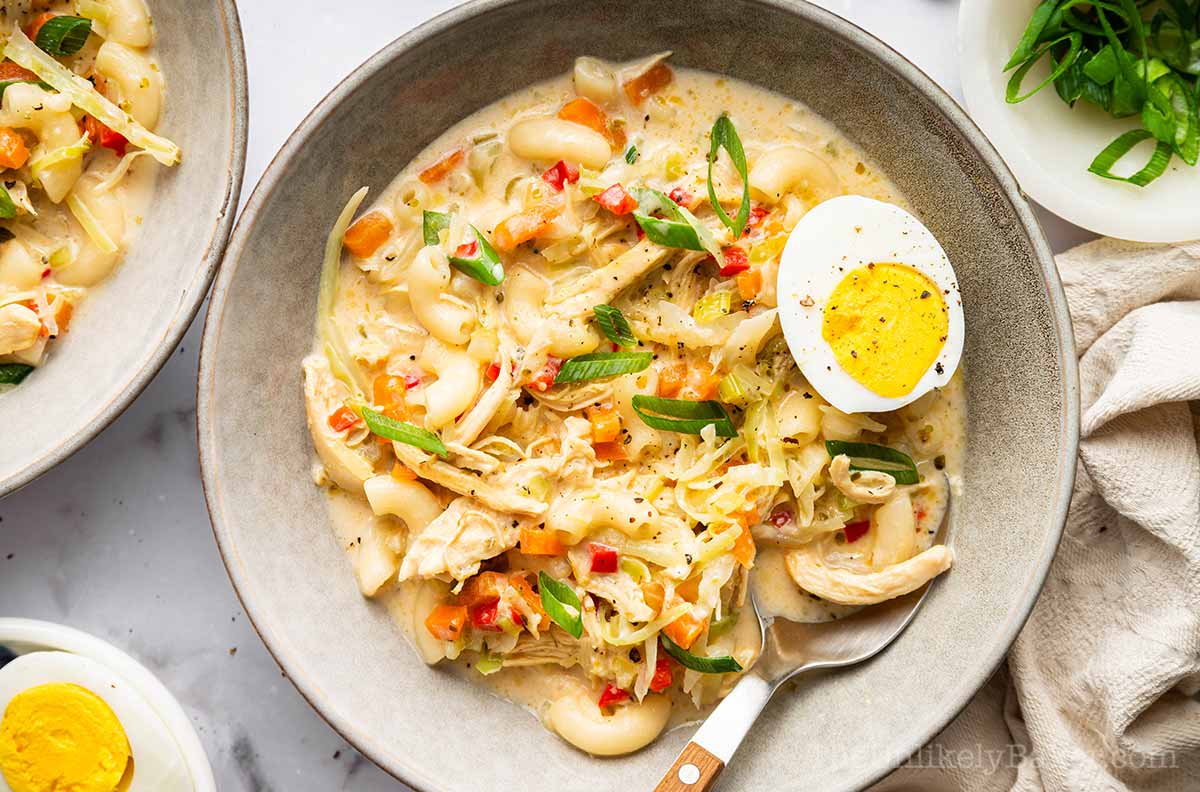 A warm bowl of chicken sopas with evaporated milk.