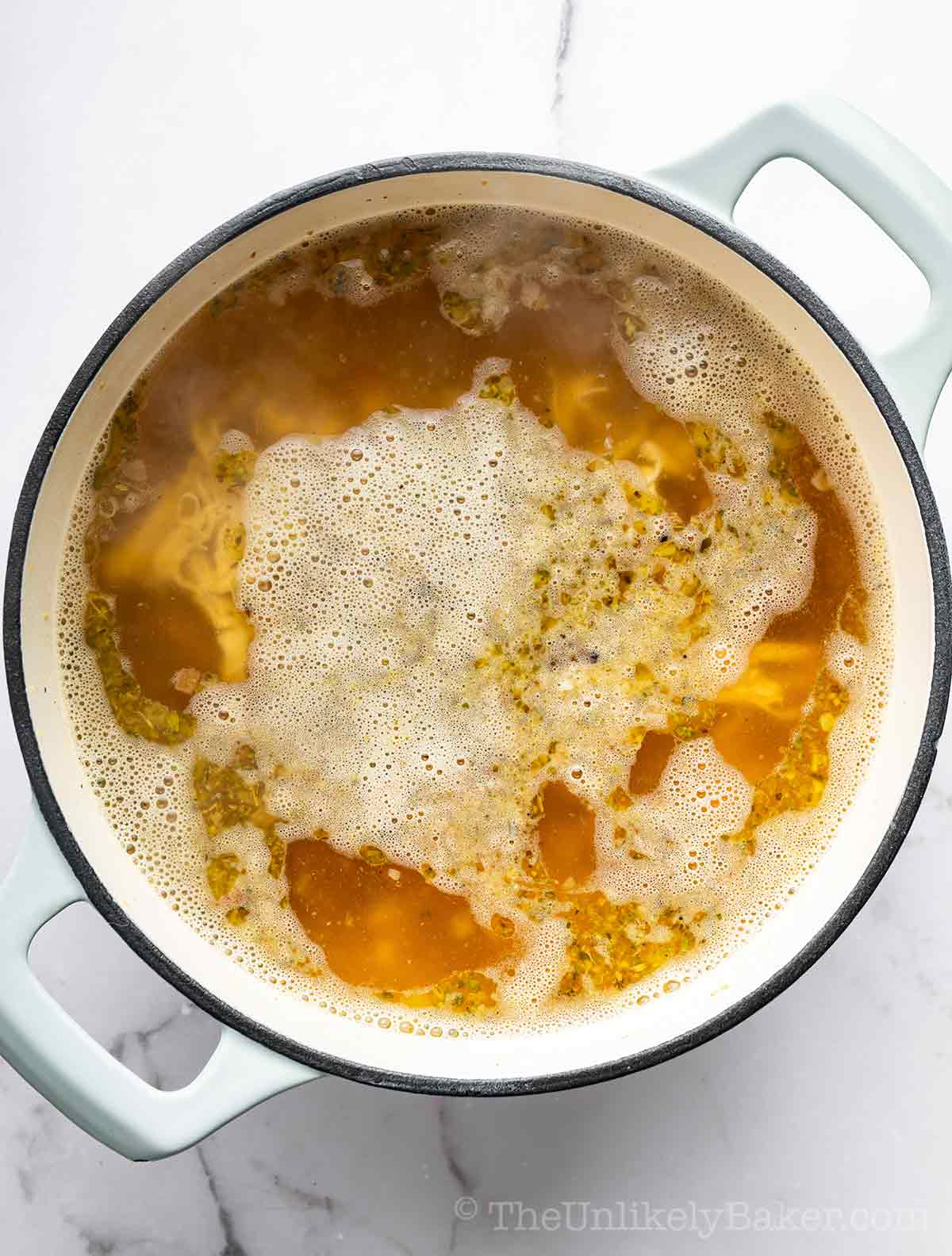 Simmering chicken broth.