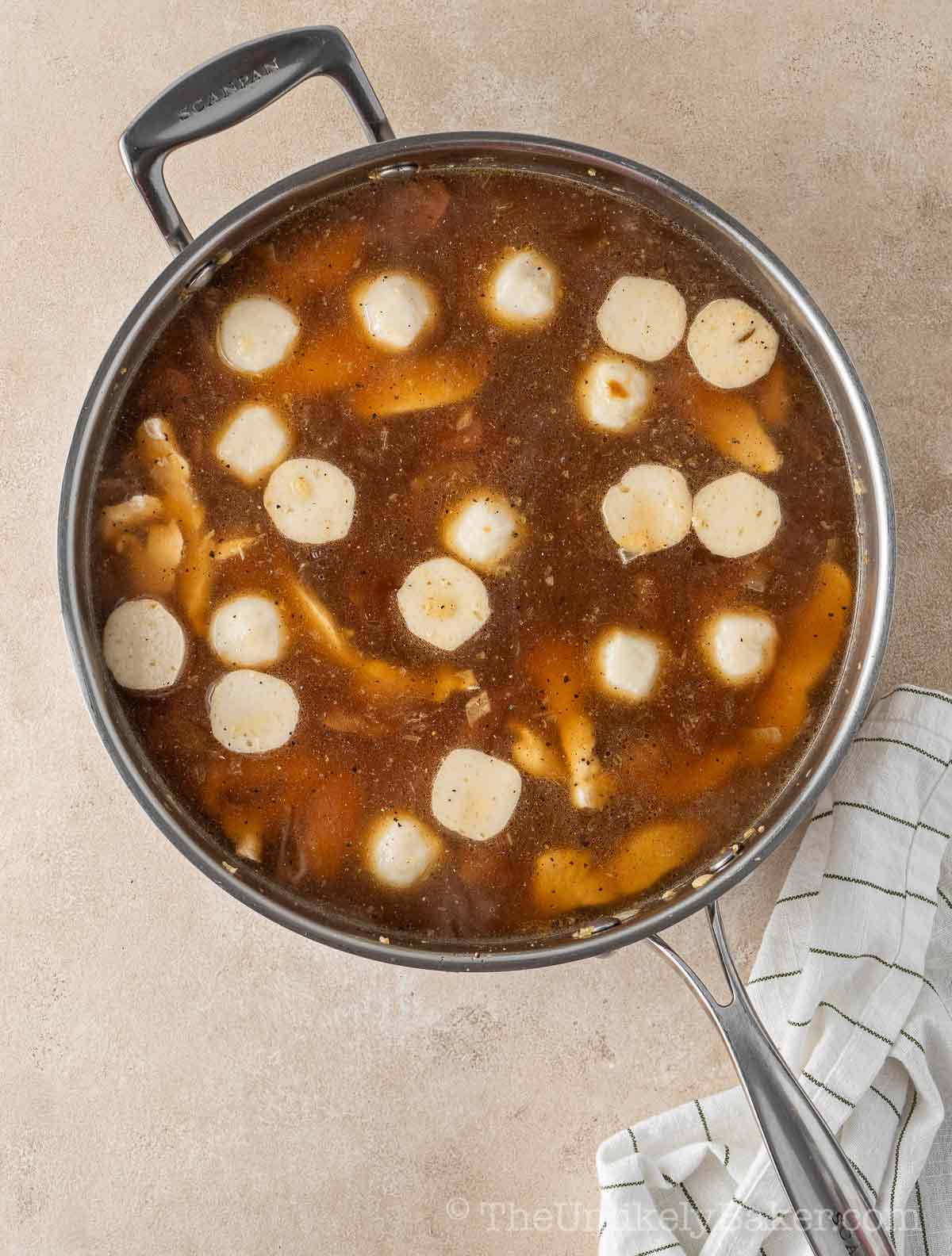 Broth added to pan.