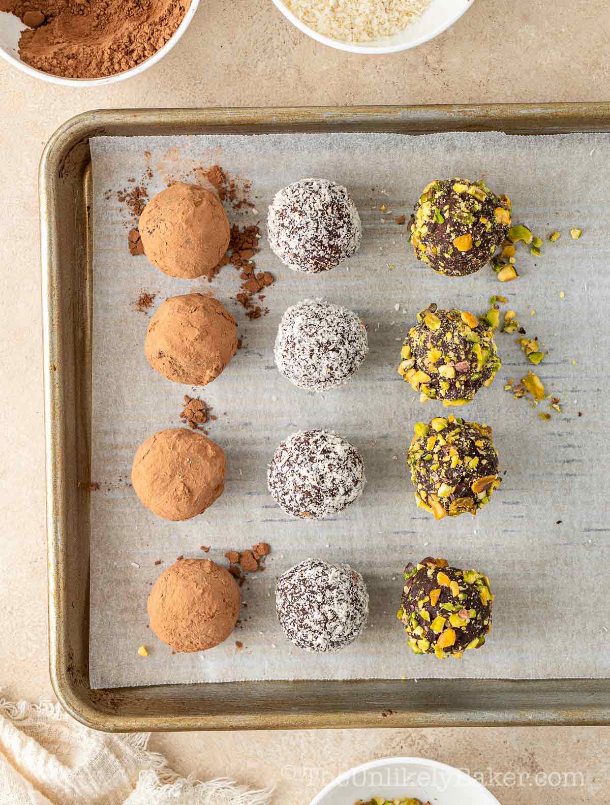 Freshly made Irish cream chocolate truffles on a pan.