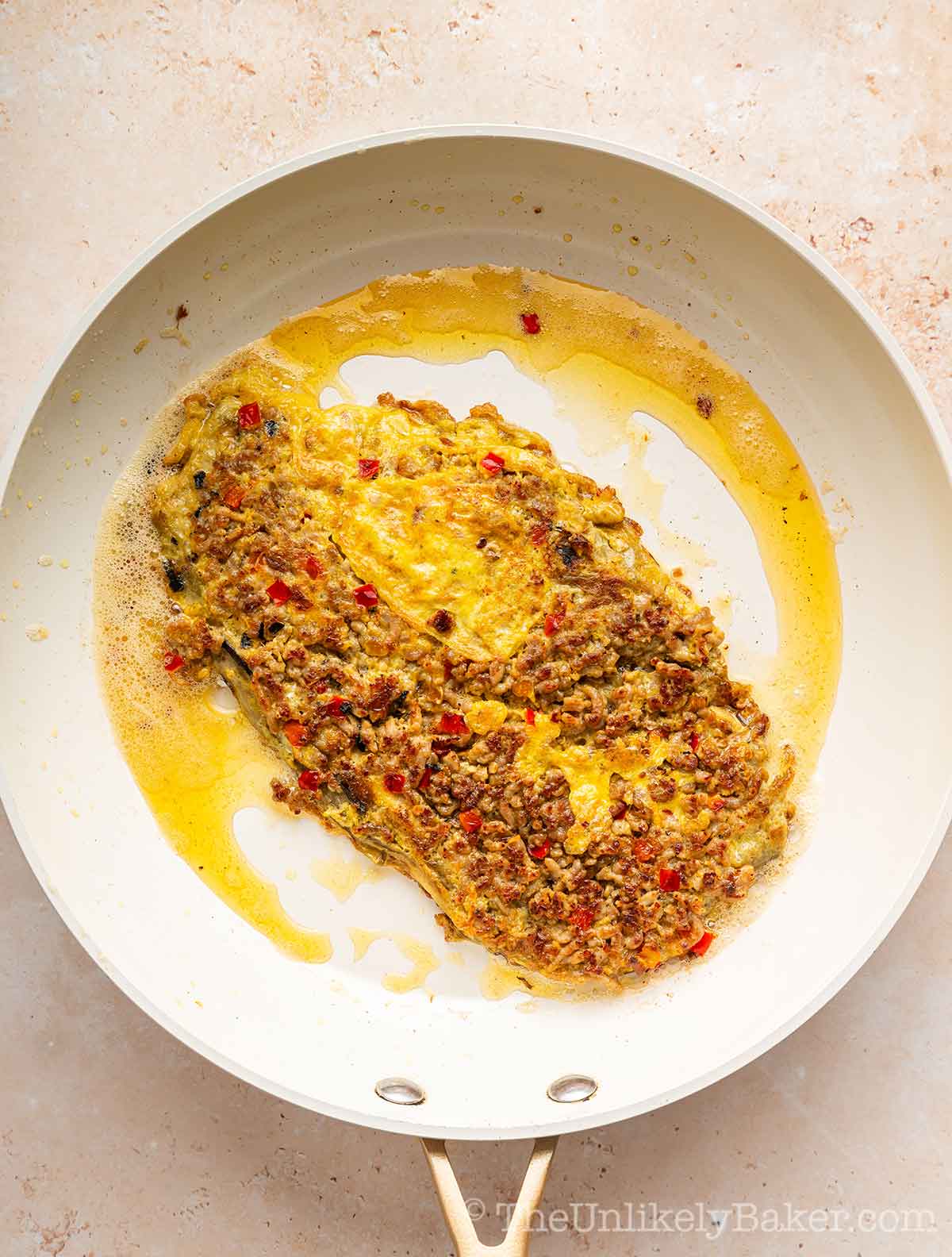 Fried eggplant omelette in a pan.