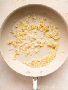 Shallots and garlic in a pan.