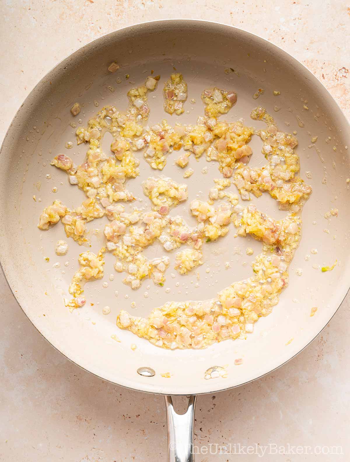 Shallots and garlic in a pan.