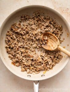 Ground pork in a pan.