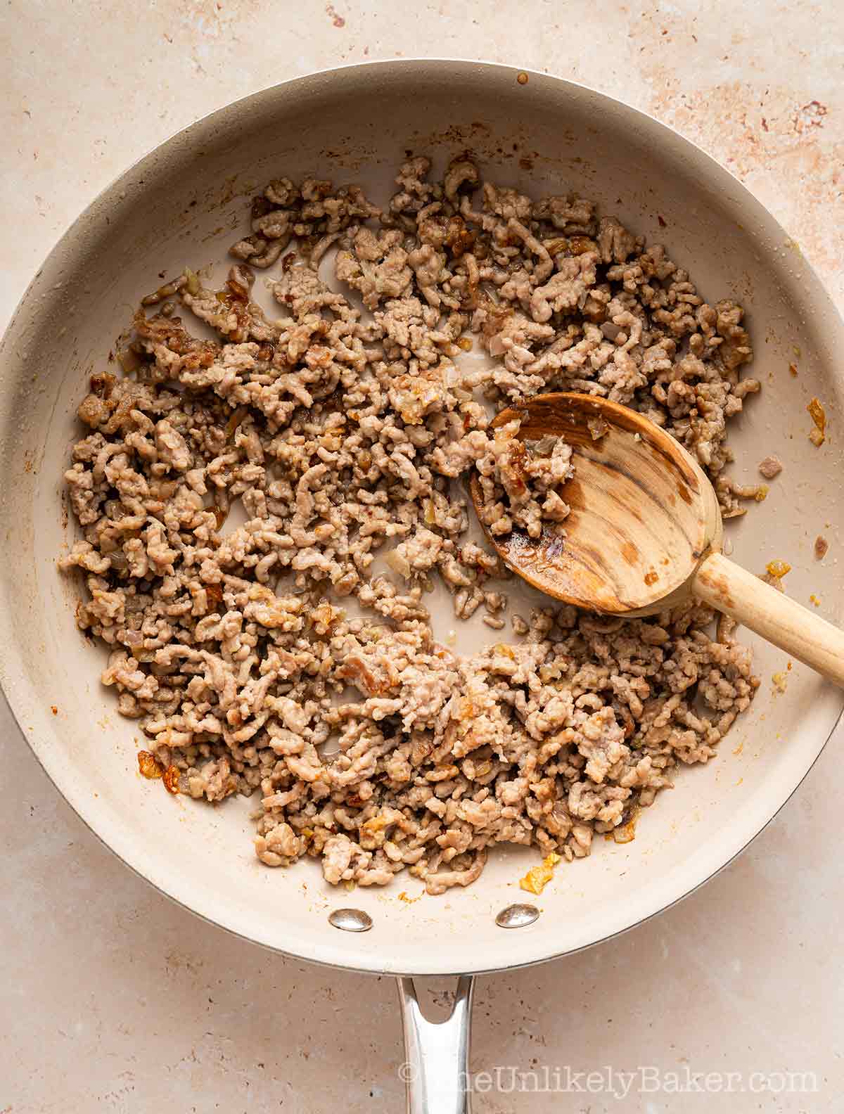 Ground pork in a pan.