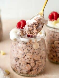 White chocolate raspberry overnight oats in individual jars.