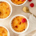 Baileys creme brulee topped with raspberries.