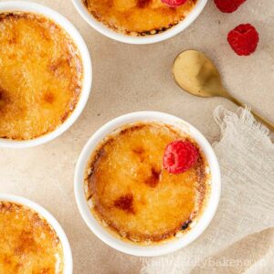 Baileys creme brulee topped with raspberries.