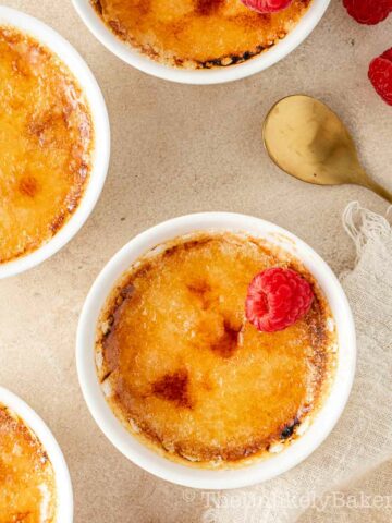Baileys creme brulee topped with raspberries.