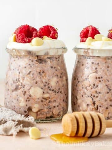 Raspberry and white chocolate oats topped with fresh raspberries.