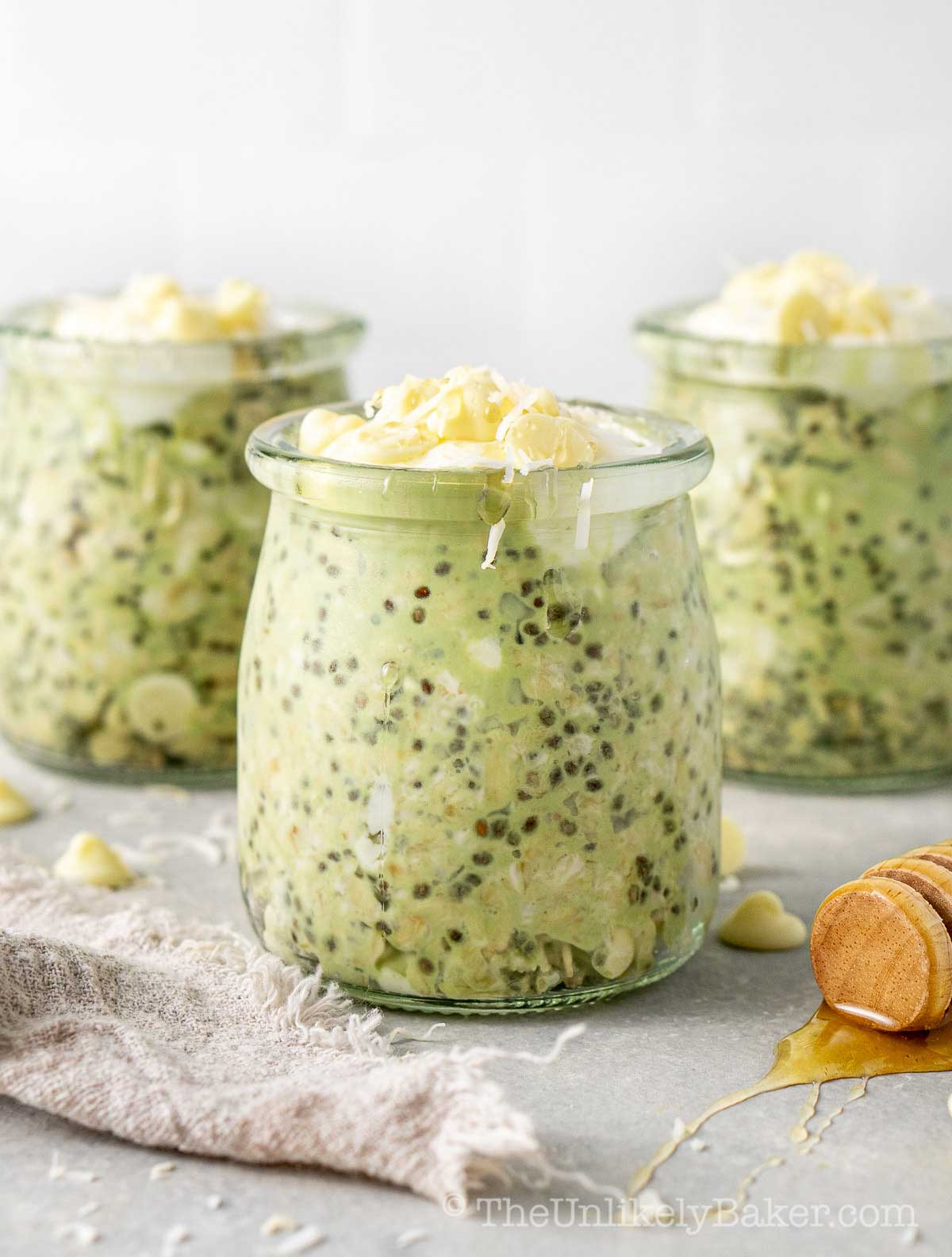 Matcha overnight oats topped with white chocolate chips.