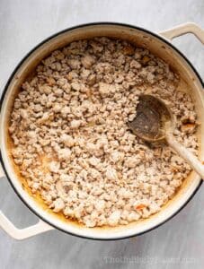 Ground turkey in a pan.