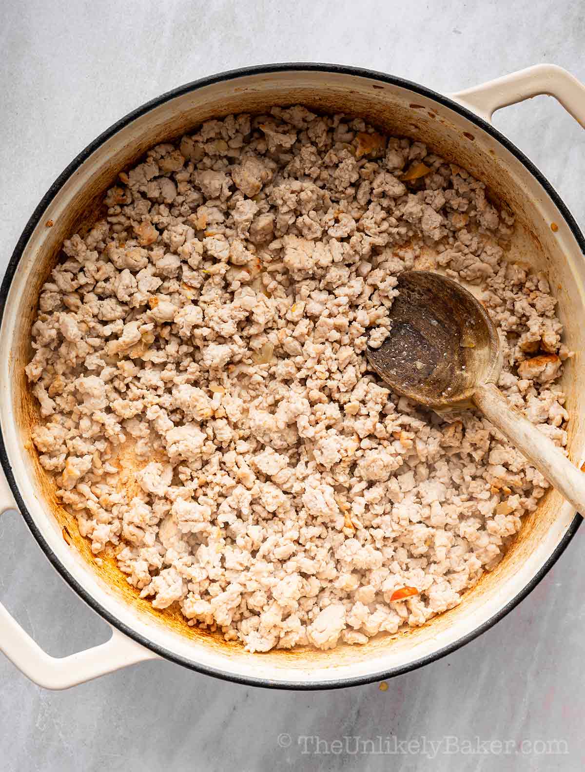Ground turkey in a pan.