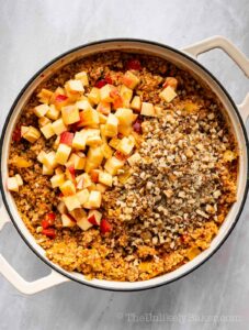 Apples and walnuts added to cooked bulgur.