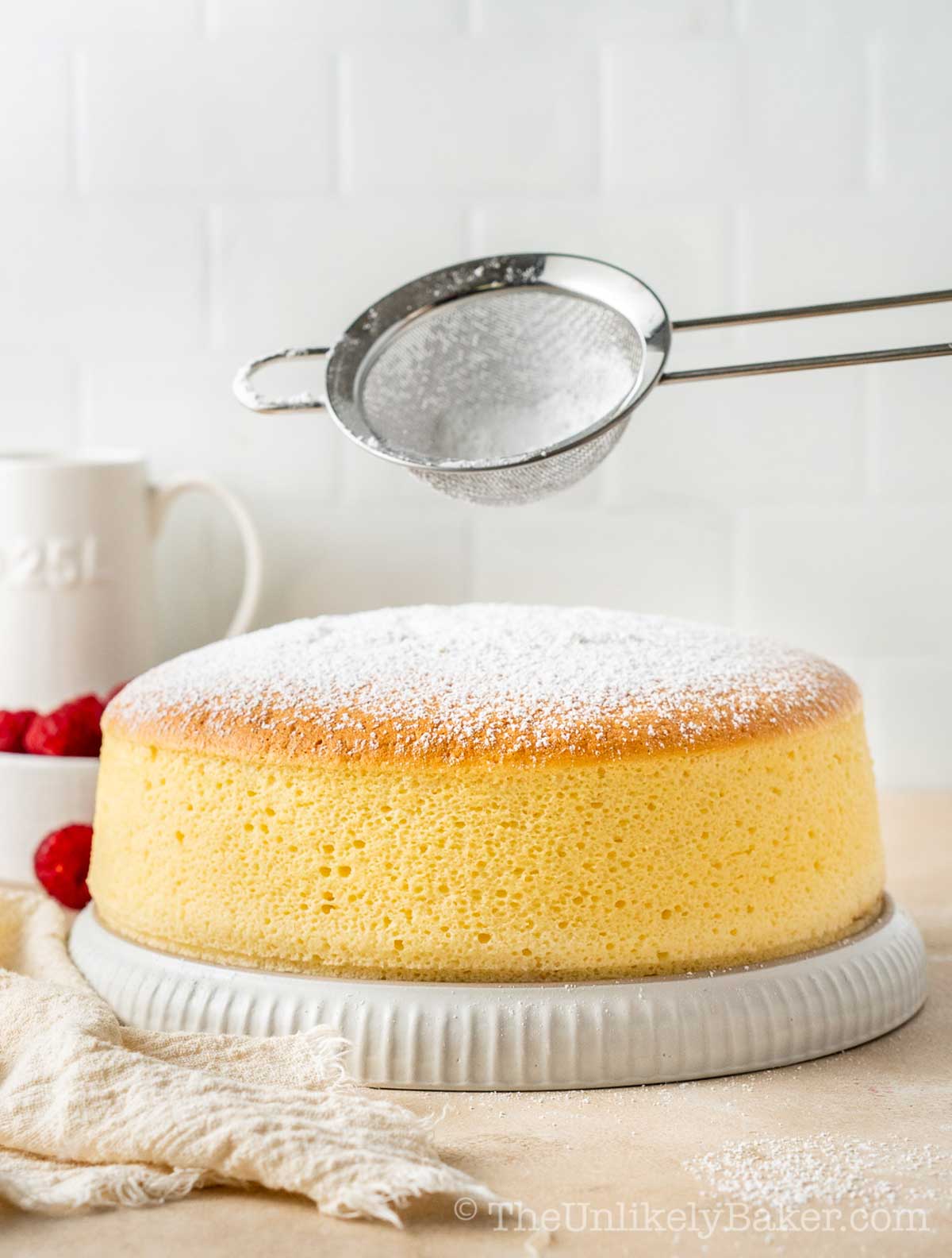 Icing sugar sprinkled on top of freshly baked Japanese cheesecske.