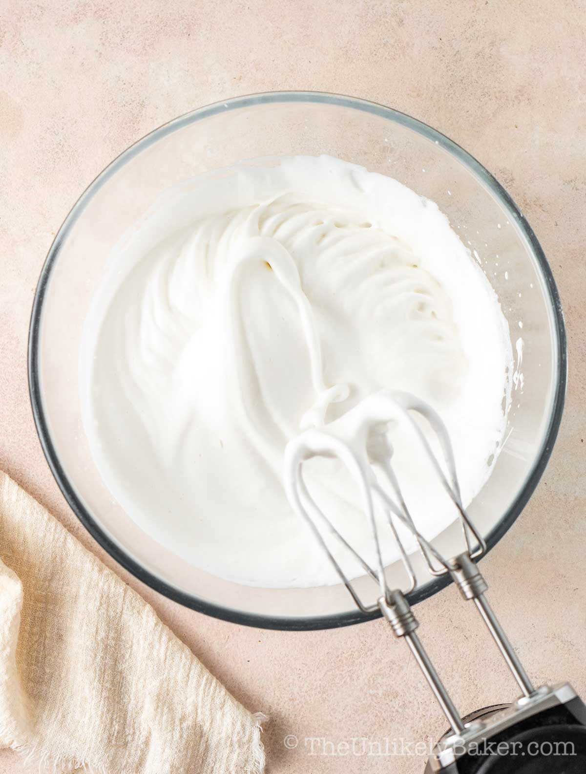 Egg whites whipped to soft peaks.