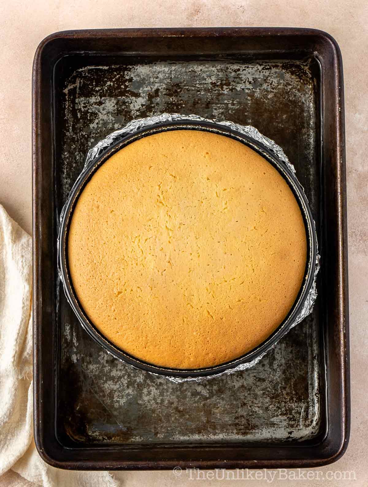 Freshly baked Japanese cotton cheesecake in a cake pan.