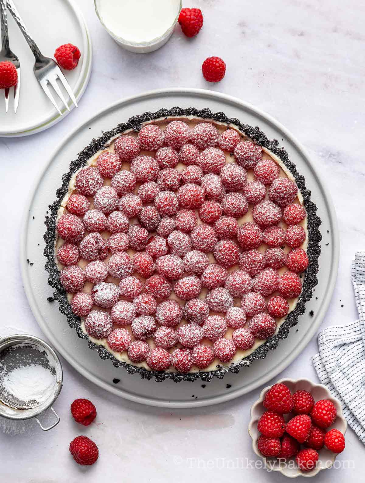 White chocolate raspberry tart with an Oreo cookie crust.