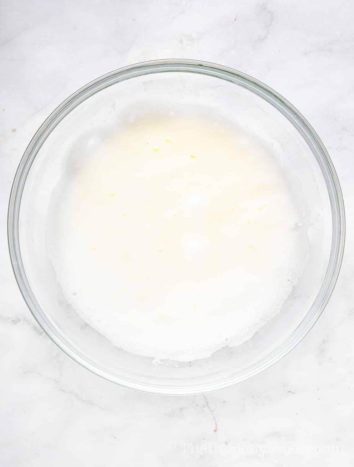 Egg whites whipped to soft peaks.