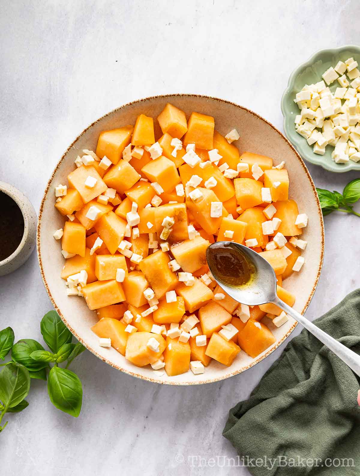 Salad dressing added to cantaloupe.