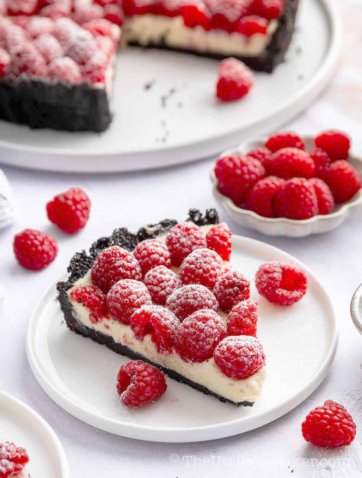 A slice of raspberry white chocolate tart.