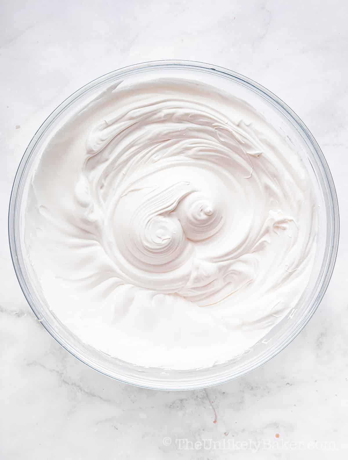 Egg whites whipped to stiff peaks.