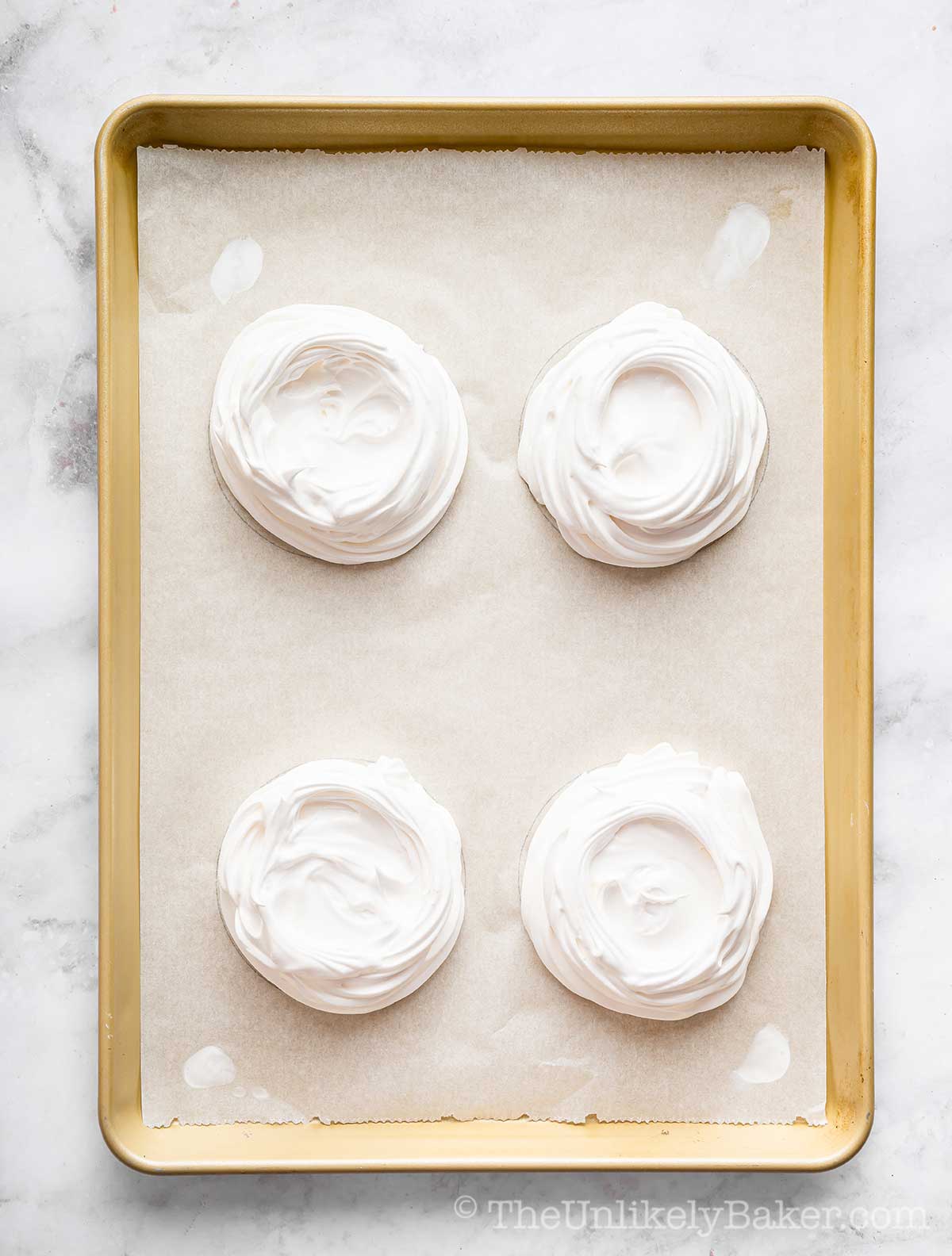 Meringue scooped onto a pan.