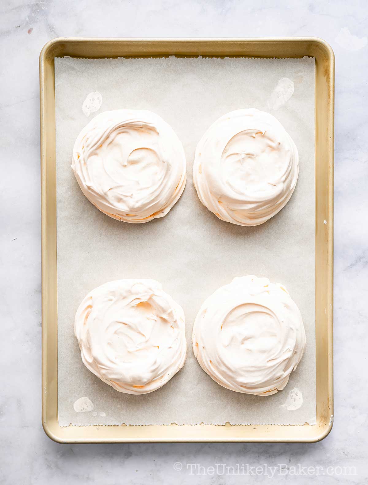 Freshly baked meringue on a pan.