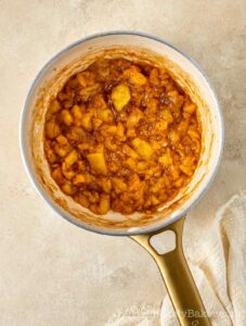 Peach mango pie mixture in saucepan.