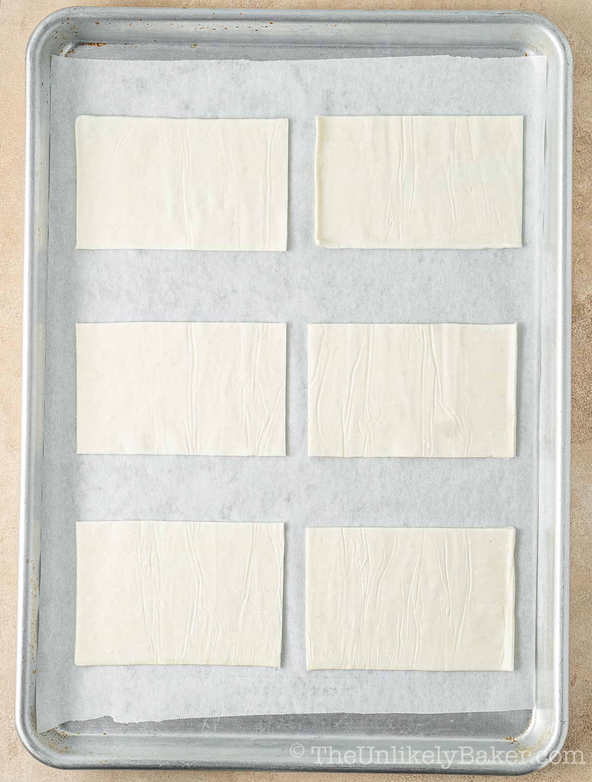 Puff pastry on baking sheet.