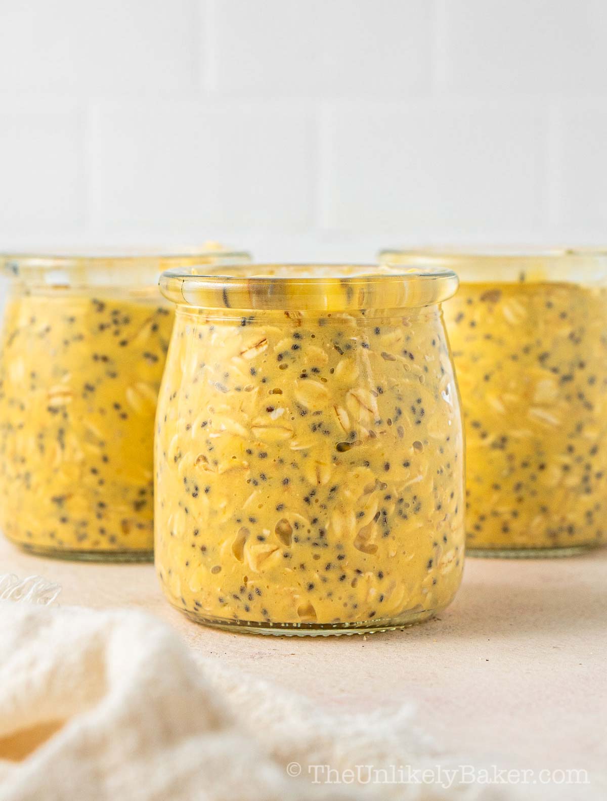 Overnight oats mango in mason jars.