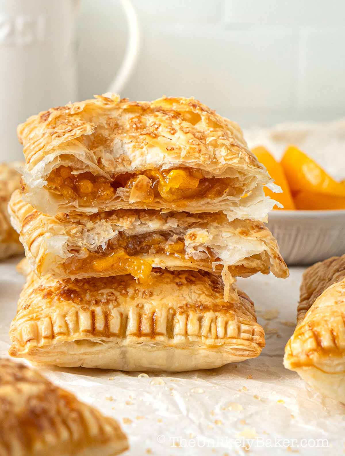 A stack of peach mango hand pies.