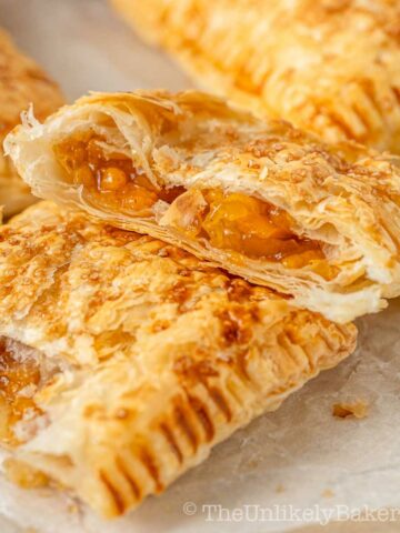 Crispy flaky peach mango pie with a gooey fruit filling.