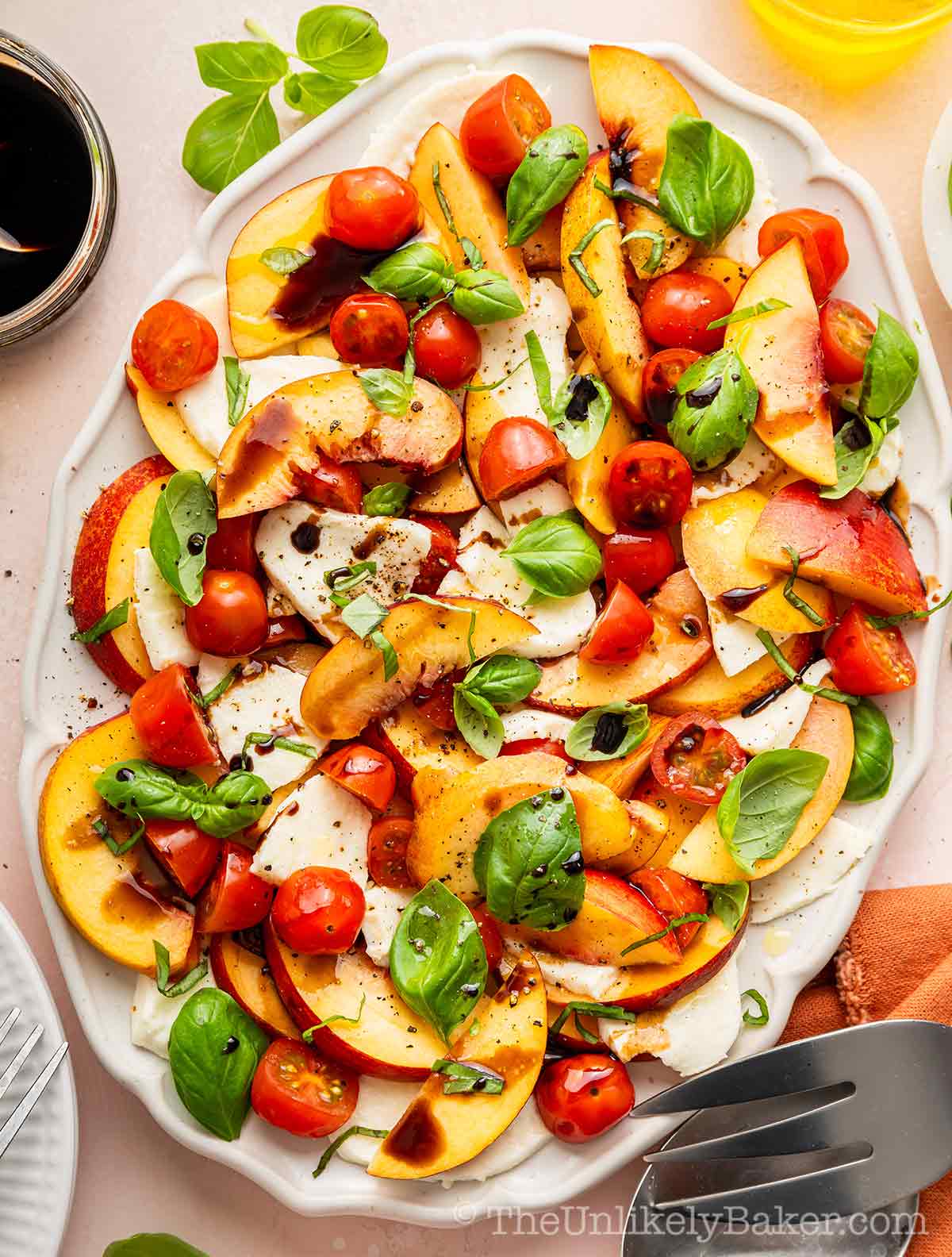 Peach caprese salad on a serving platter.