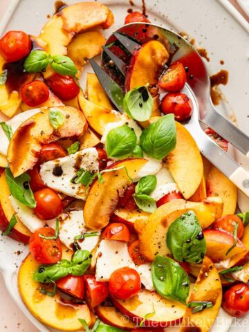 Fresh peach caprese salad with balsamic reduction.