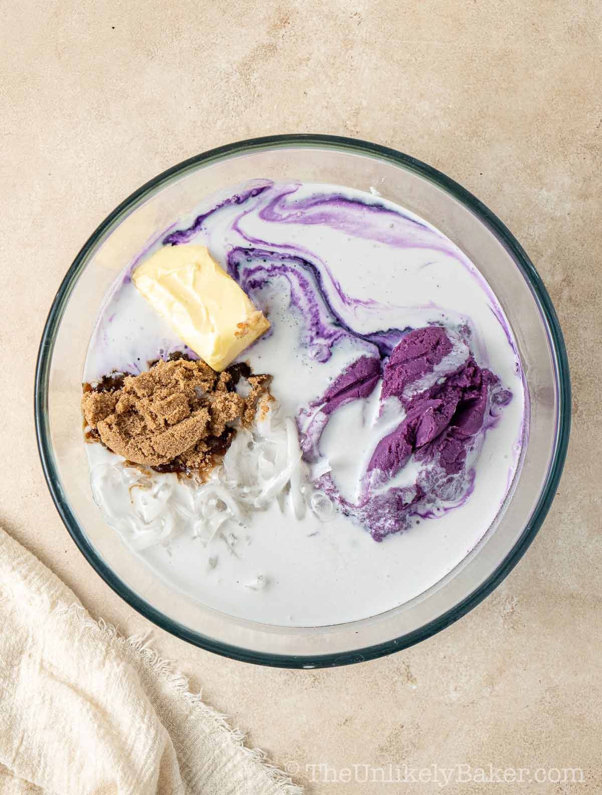 Cassava ube cake ingredients in a bowl.
